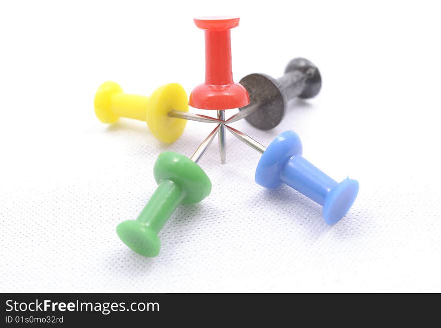 A set of color pins on white background. A set of color pins on white background