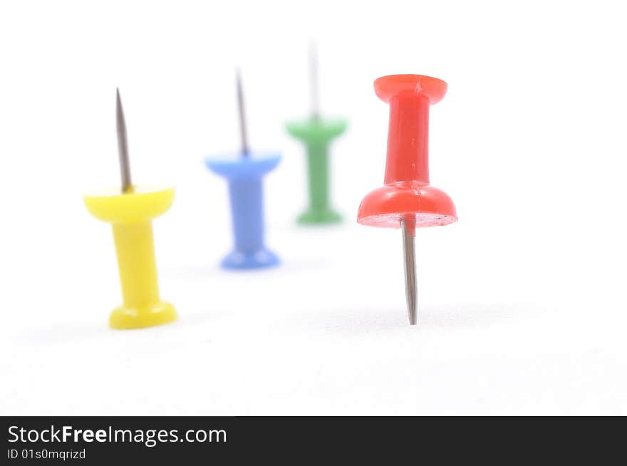 A set of color pins on white background. A set of color pins on white background