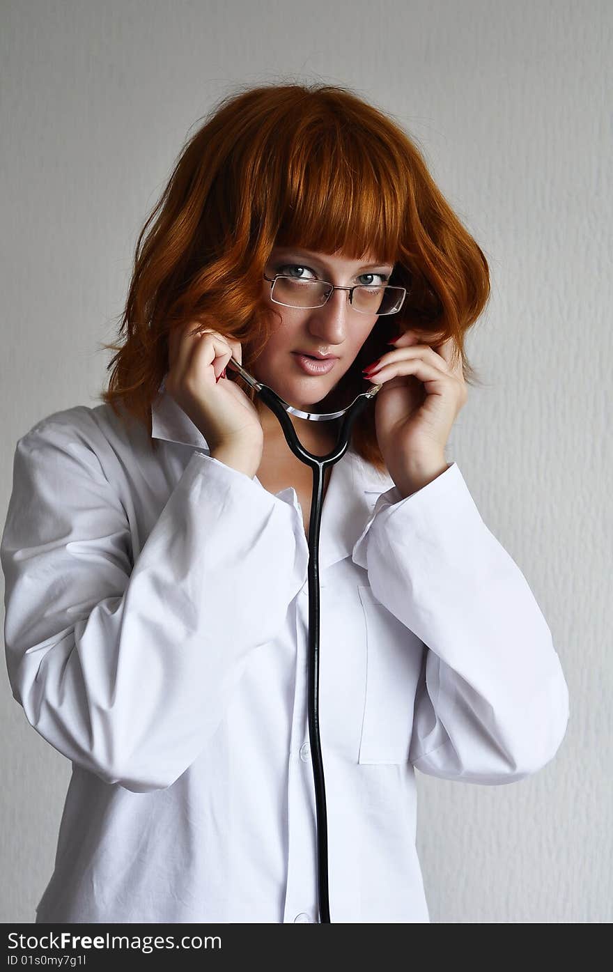 Female Doctor Puts On The Stethoscope