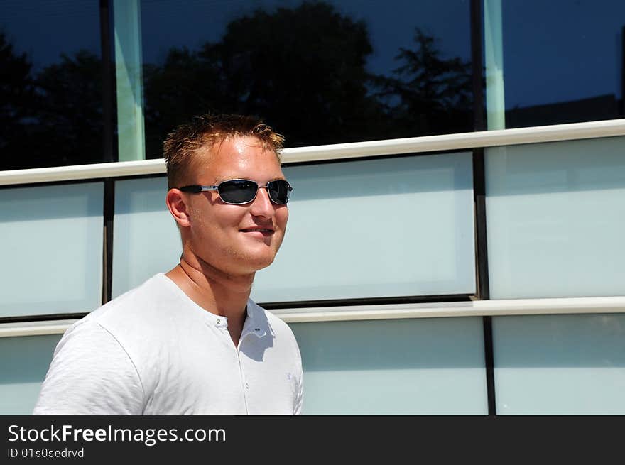 Young man in white shirt with glasses. Young man in white shirt with glasses