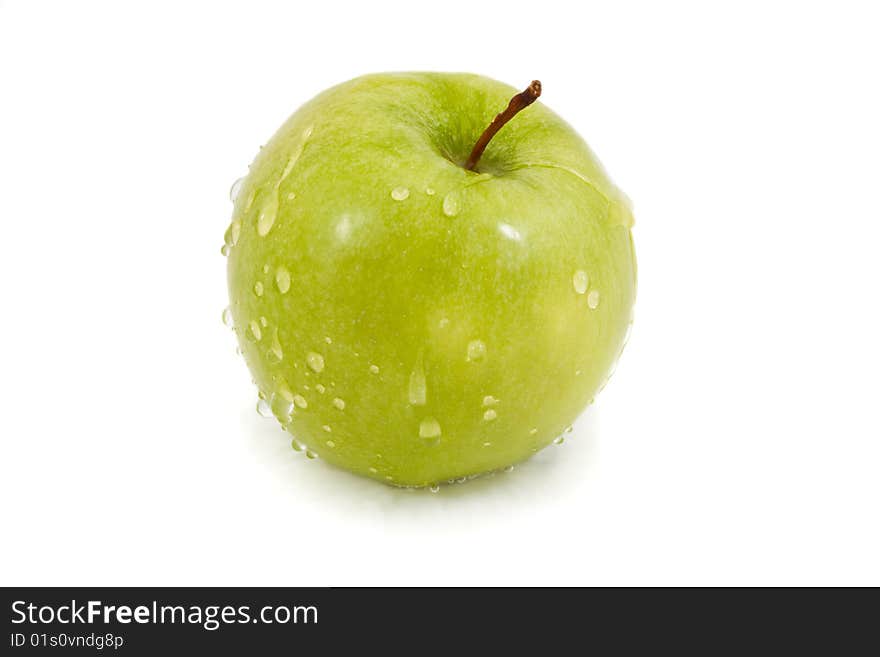 Green apple with droplets isolated on a white background