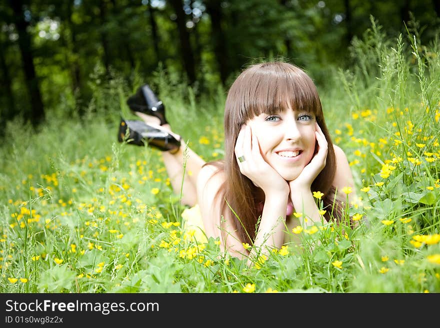 Beauty Young Woman Resting On The Meadow. Beauty Young Woman Resting On The Meadow