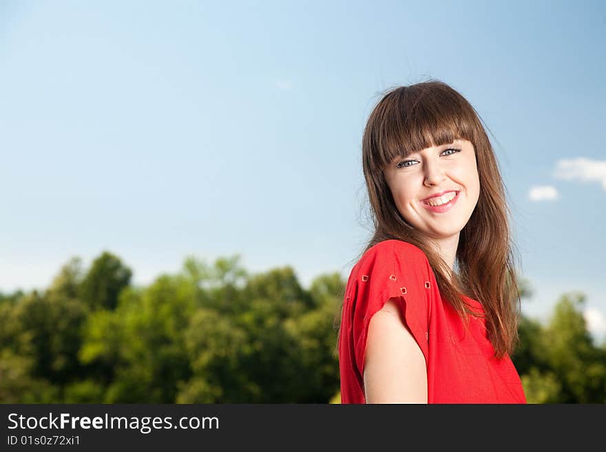 Smiling Woman Against Blue Sky