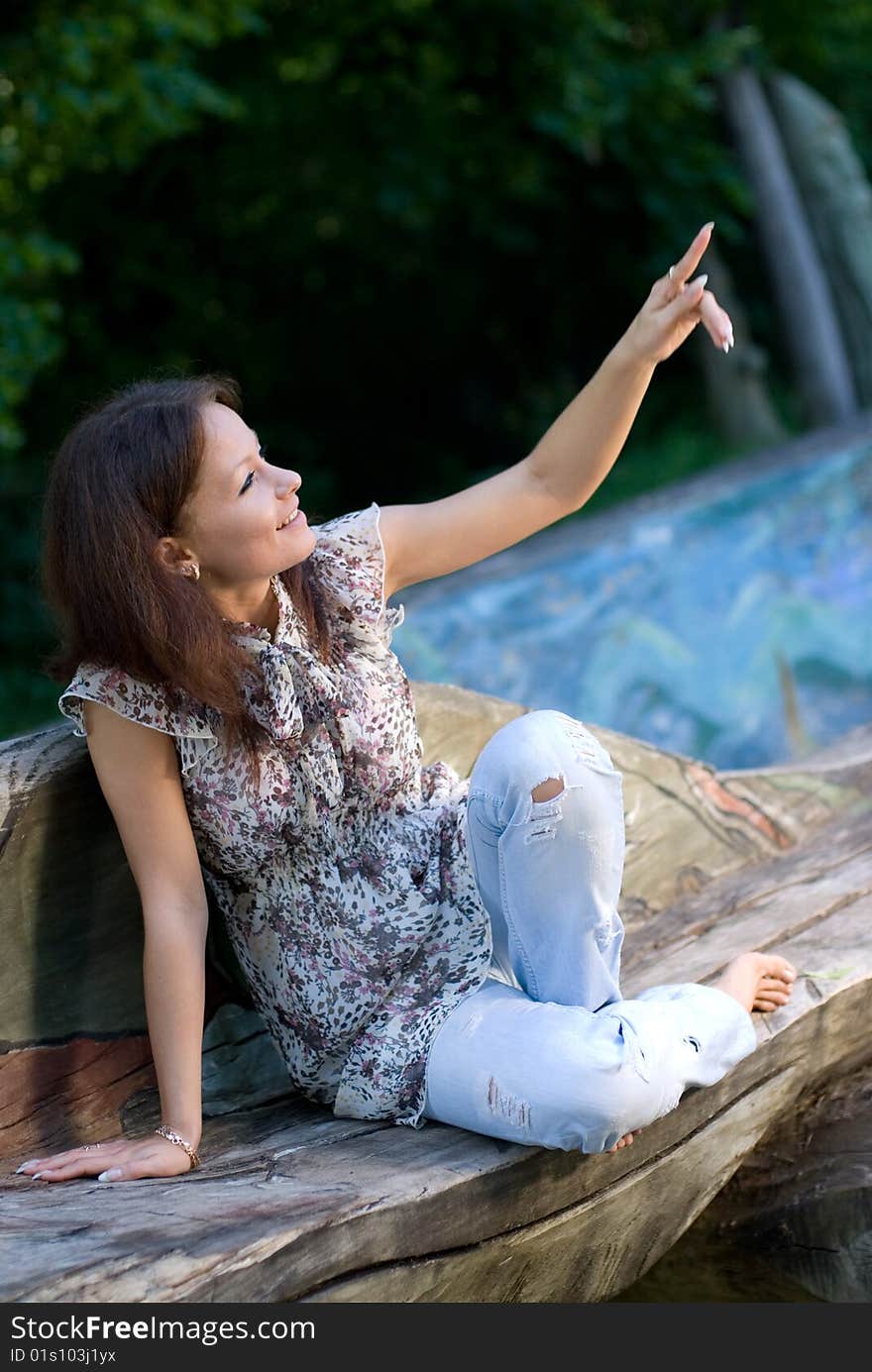 Beautiful girl smiling and show to the sky. Beautiful girl smiling and show to the sky