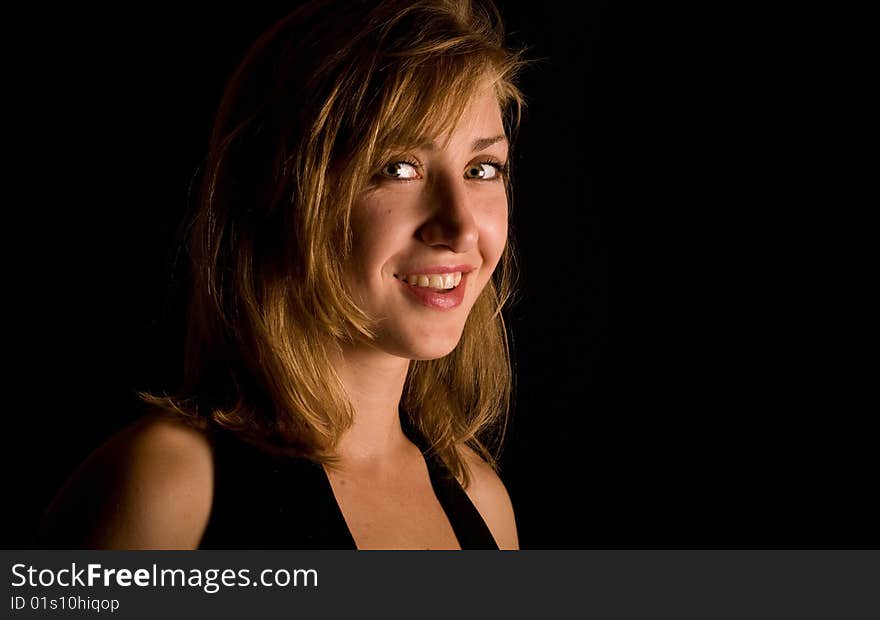 Portrait young beautiful woman on black background