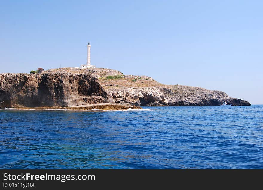 Lighthouse on rocks on the sea