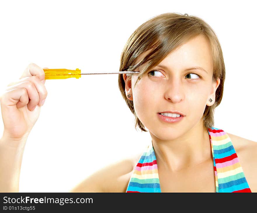 Portrait of a pretty Caucasian blond girl with a nice colorful striped summer dress who is thinking and she is holding a screwdriver to her head. Isolated on white. Portrait of a pretty Caucasian blond girl with a nice colorful striped summer dress who is thinking and she is holding a screwdriver to her head. Isolated on white.