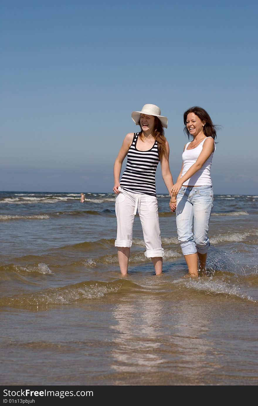 Summer Girls Playing In The Sea