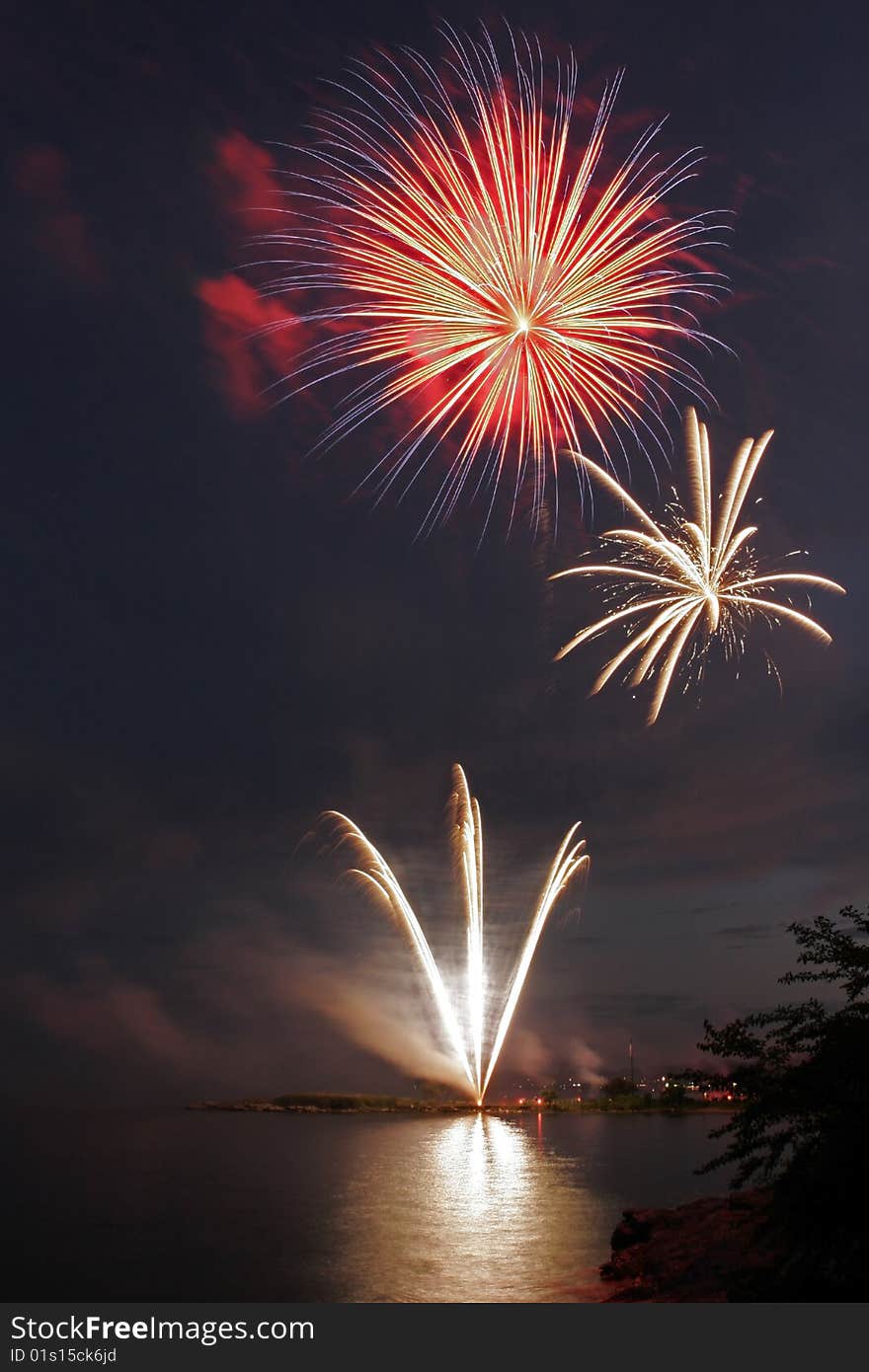 Fireworks display reflected over the waters of Long Island Sound. Fireworks display reflected over the waters of Long Island Sound.