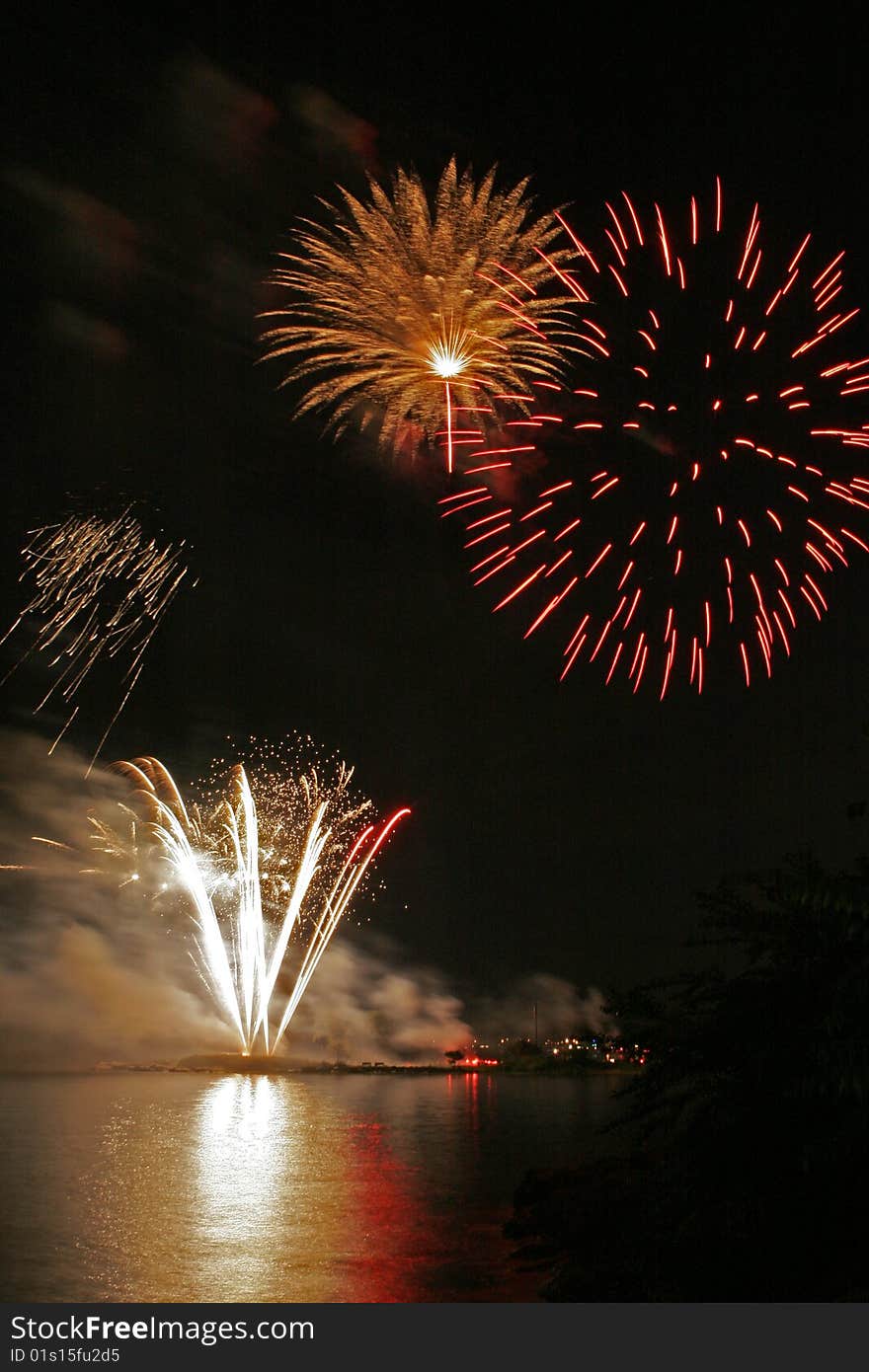 Fireworks display reflected over the waters of Long Island Sound. Fireworks display reflected over the waters of Long Island Sound.