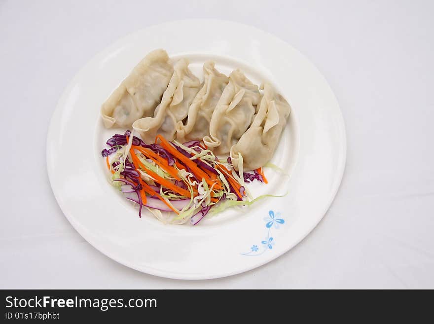 Fried Pork Dumplings on a dish with vegetable. Fried Pork Dumplings on a dish with vegetable.