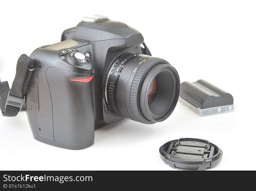 DSLR Camera, Lens Cap, Battery