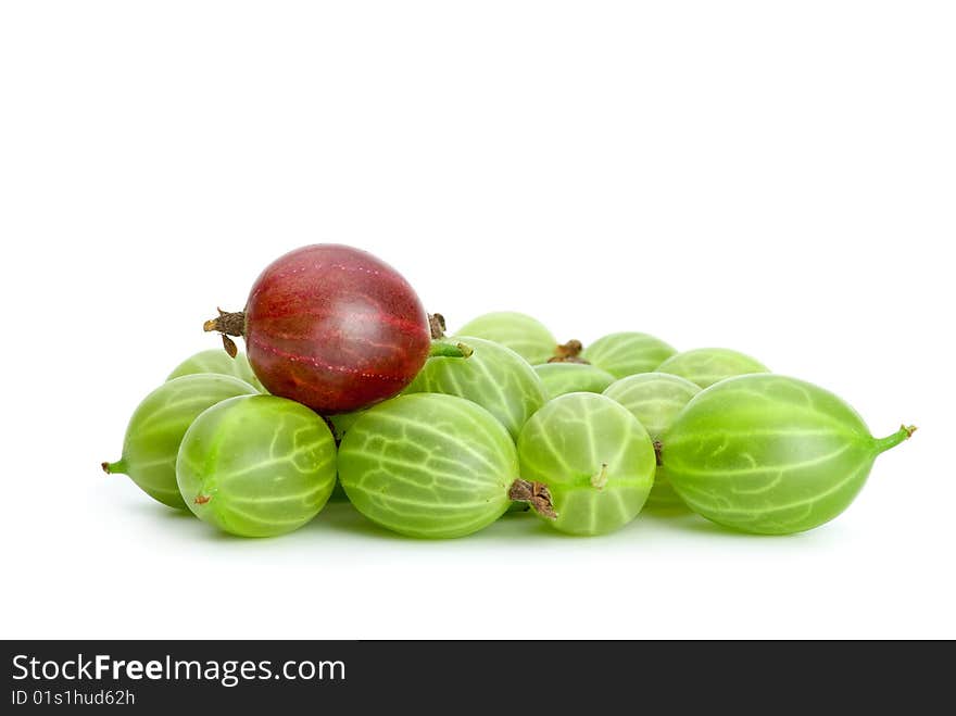 Pile of green gooseberries and purple on the top