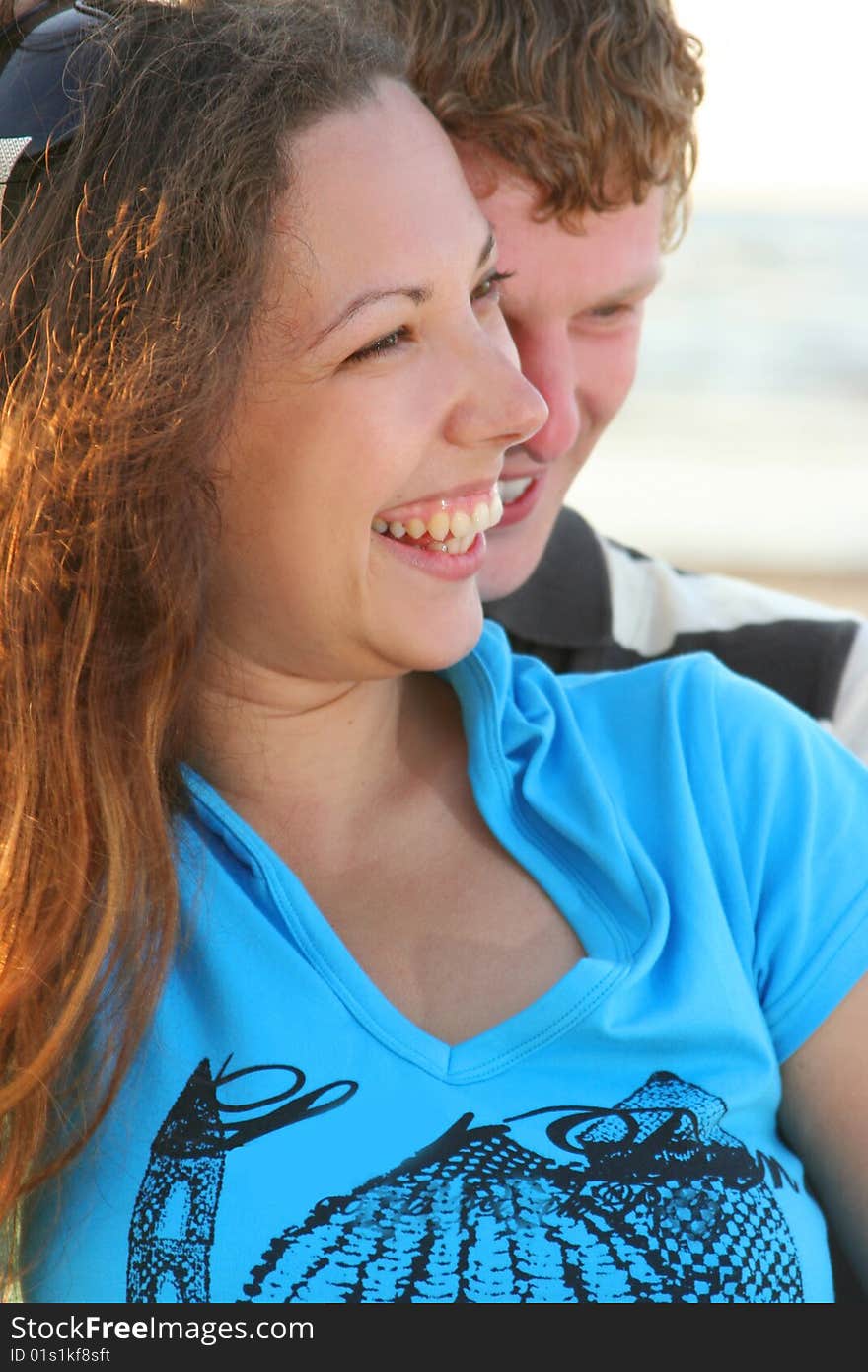 Happy young couple having fun on sea cost. Happy young couple having fun on sea cost