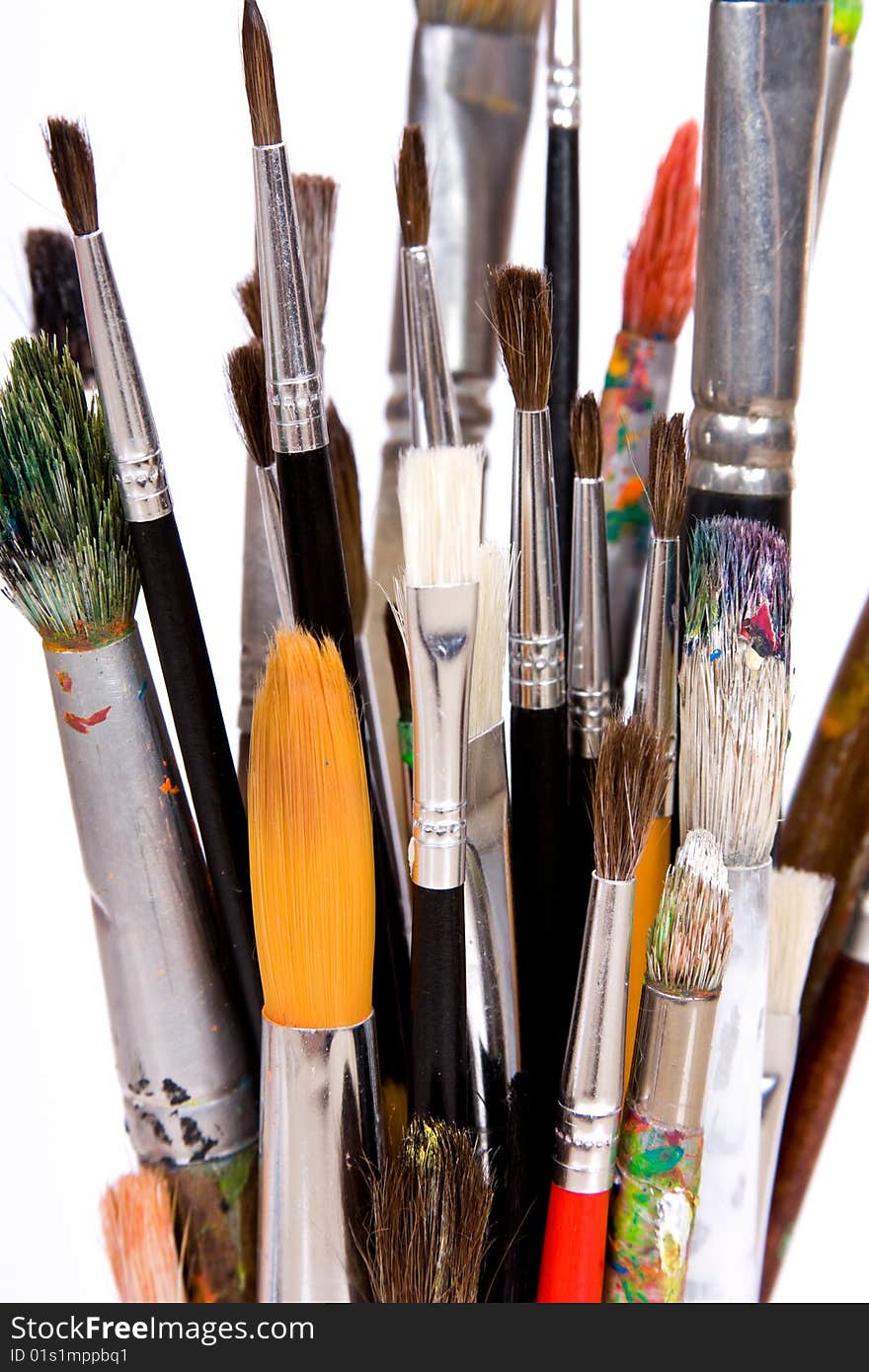 Various colored paintbrush on white background