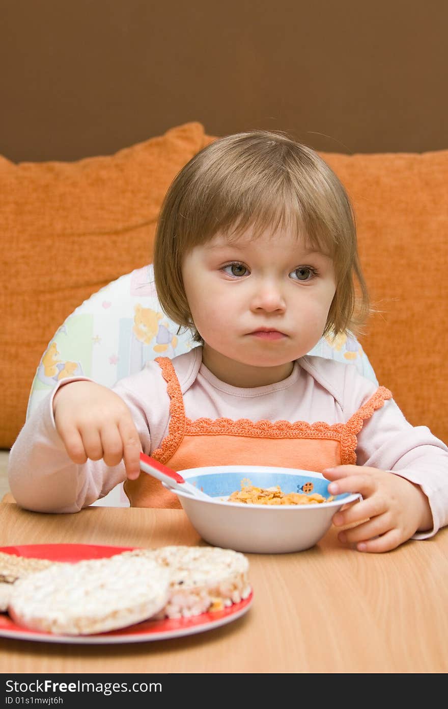 Sweet toddler baby girl eating