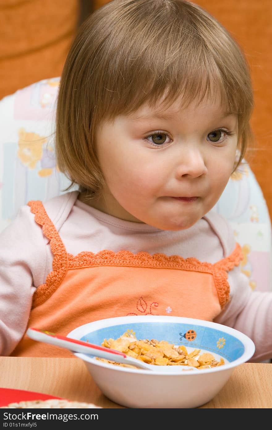 Sweet toddler baby girl eating