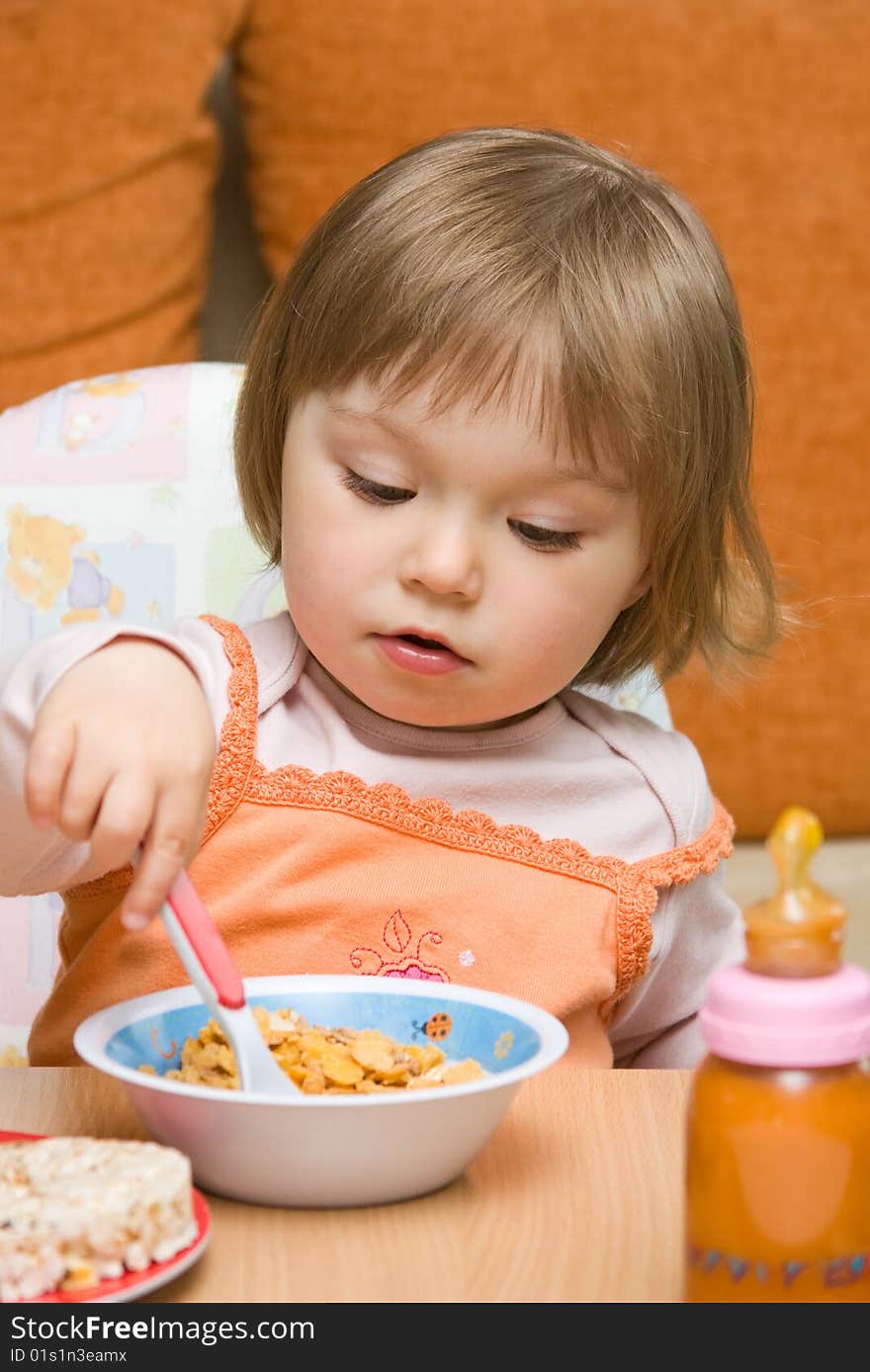 Sweet toddler baby girl eating