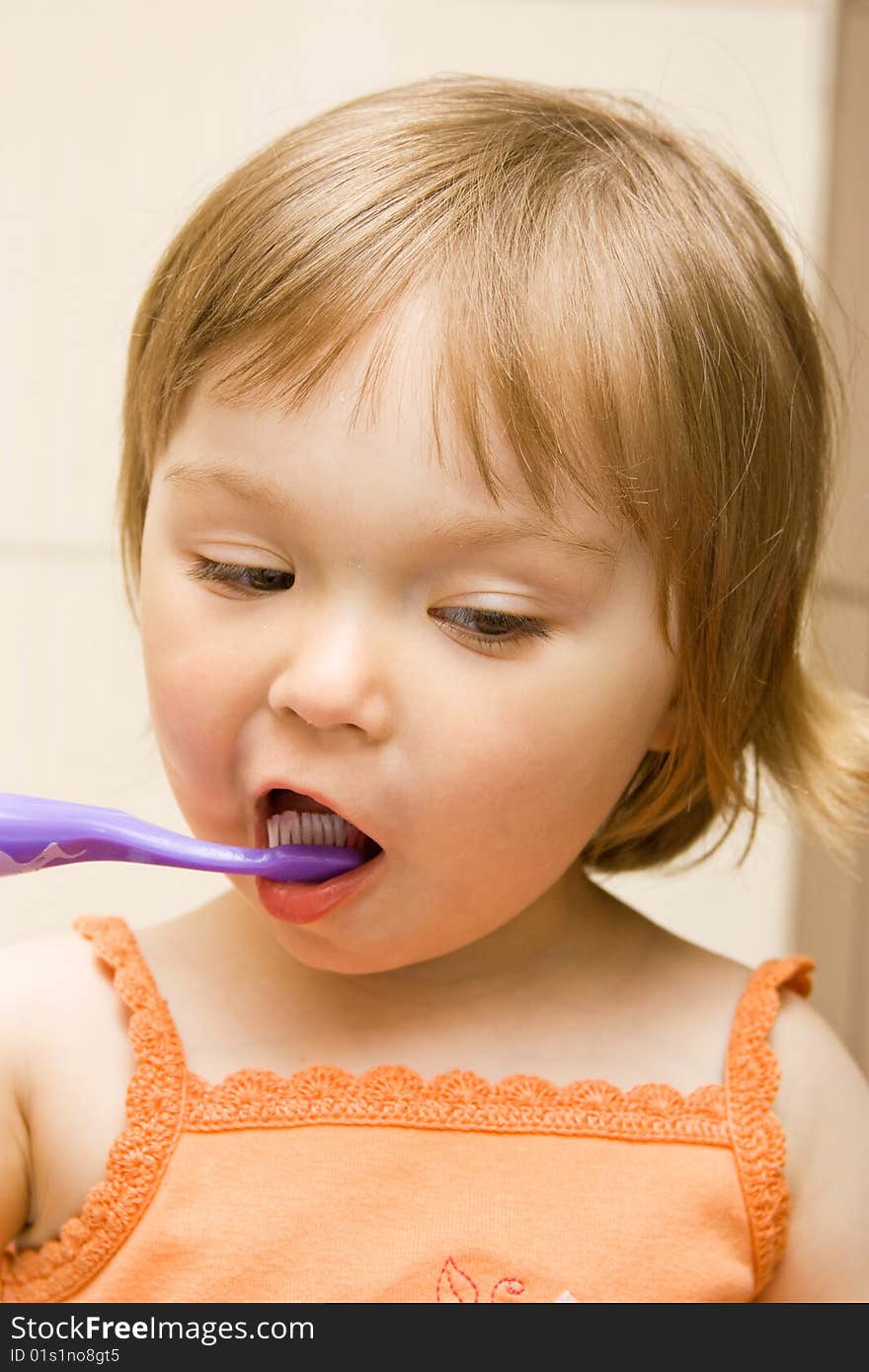 Sweet toddler baby girl cleaning teeth. Sweet toddler baby girl cleaning teeth