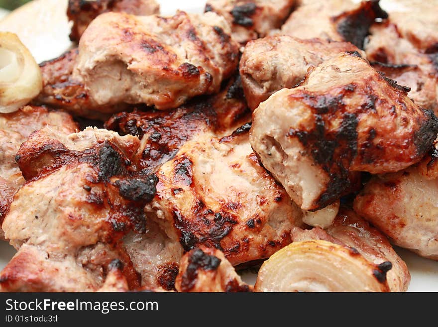 Shish kebab - shashlik - caucasian kitchen. Meat on skewers fried on coals. Shish kebab - shashlik - caucasian kitchen. Meat on skewers fried on coals.