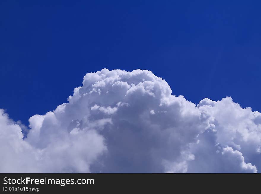 Thick cumulus clouds, a young heat generated thunderstorm.