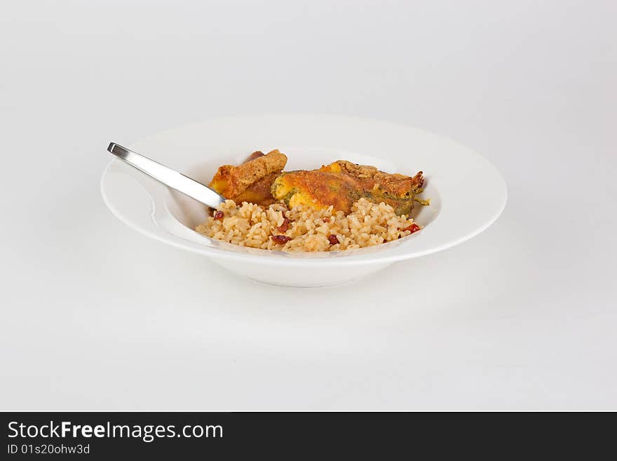 Chili rellenos and rice dish