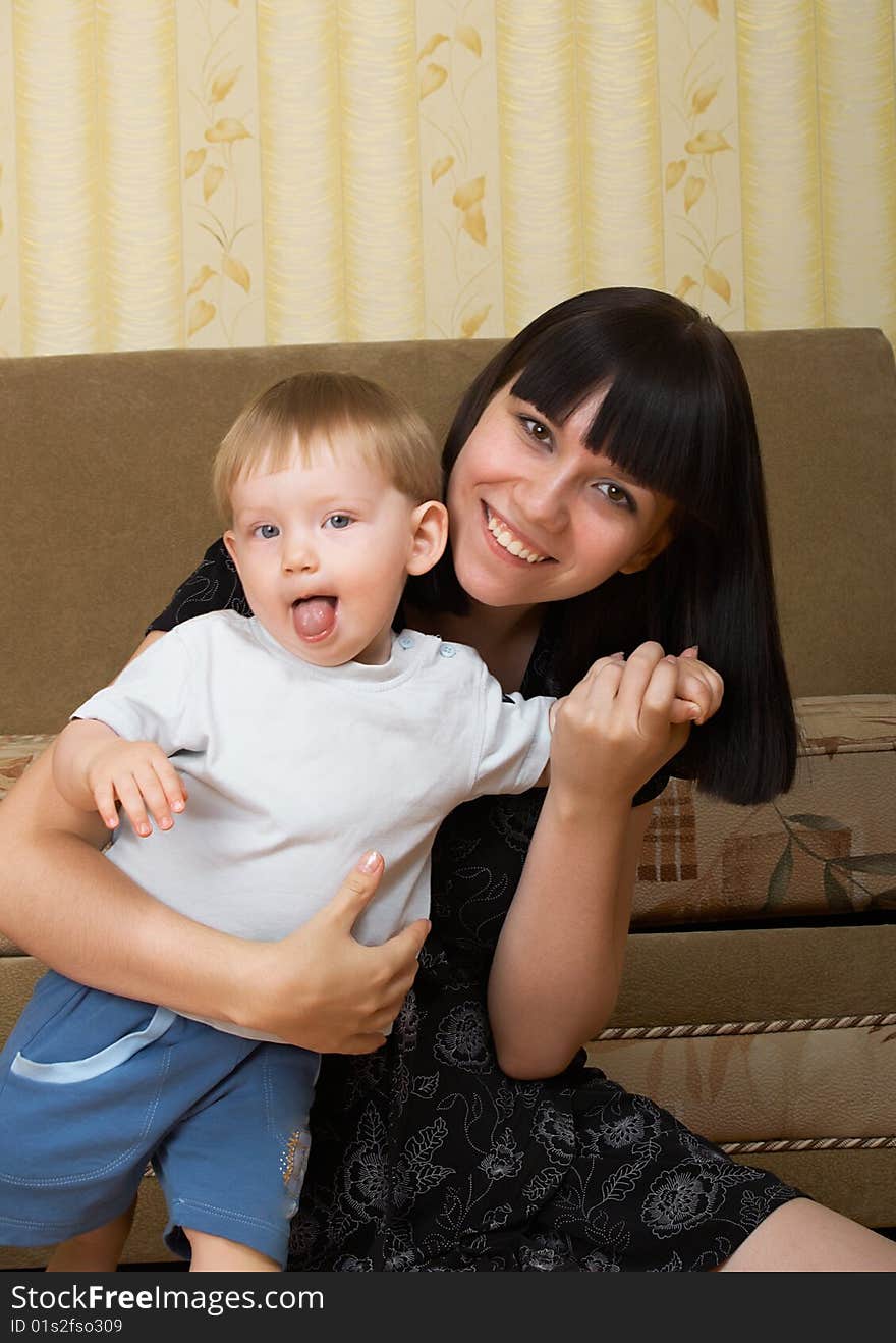 The little boy with mum on the white background. The little boy with mum on the white background