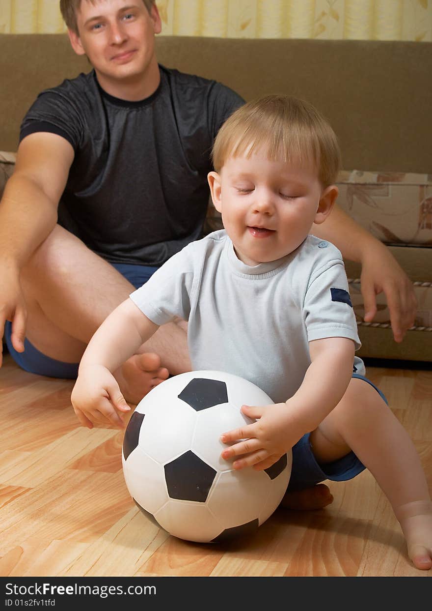 The daddy with the son play together houses. The daddy with the son play together houses