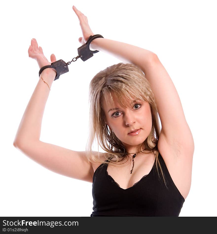 Young woman in handcuffs. Studio shoot on white background. Young woman in handcuffs. Studio shoot on white background