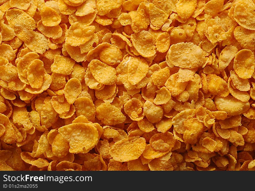 Background of many crispy cornflakes. Background of many crispy cornflakes