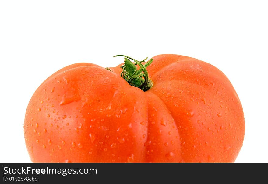 Ripe tomato on a white background. Close-up. Macro.