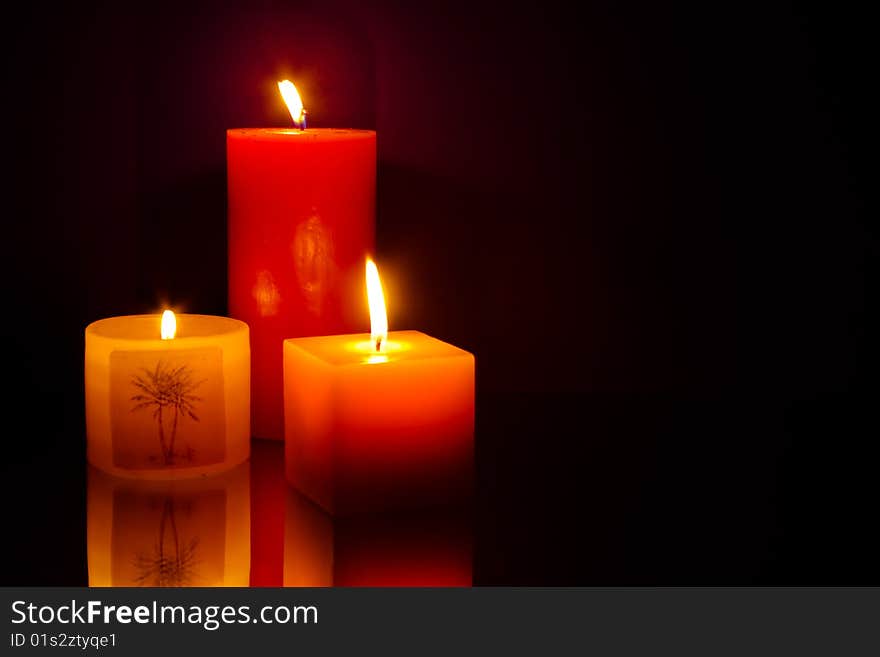 Three candles on blue background