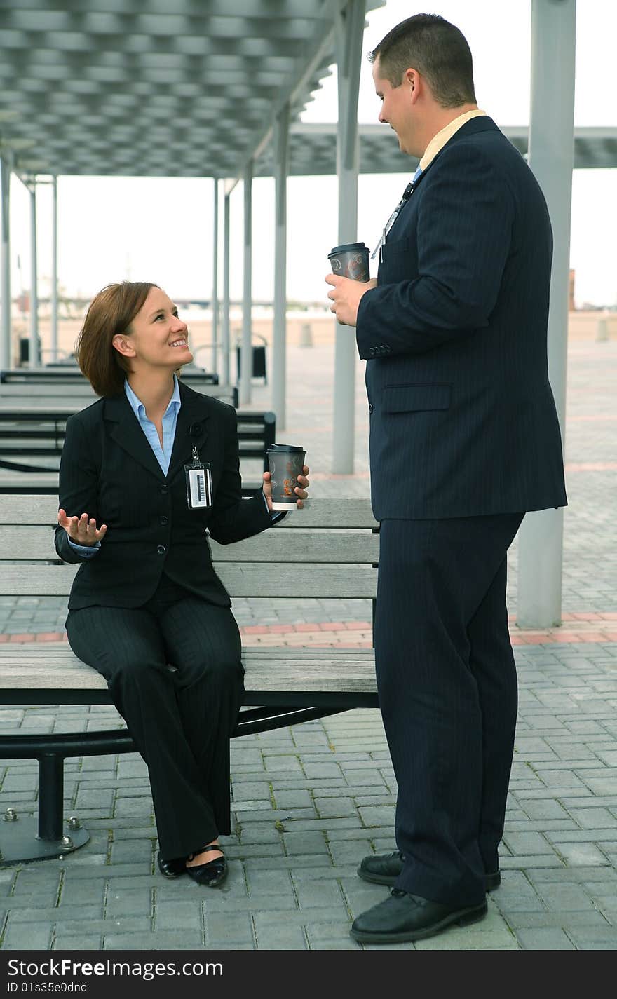 Two business people having informal business discussion outdoor. Two business people having informal business discussion outdoor