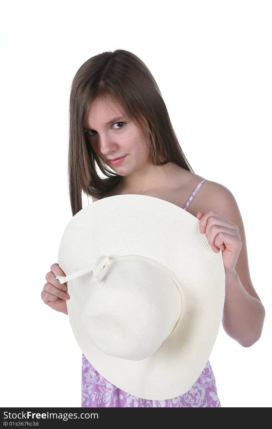 Pretty teen in purple dress with straw hat