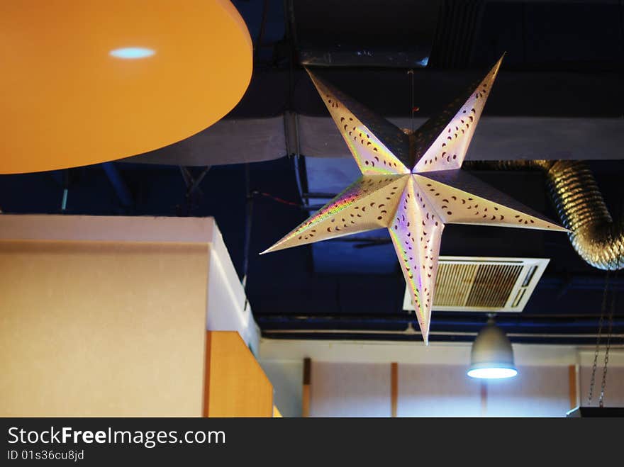 Is hanging at the sushi shop smallpox's giant five pointed star.