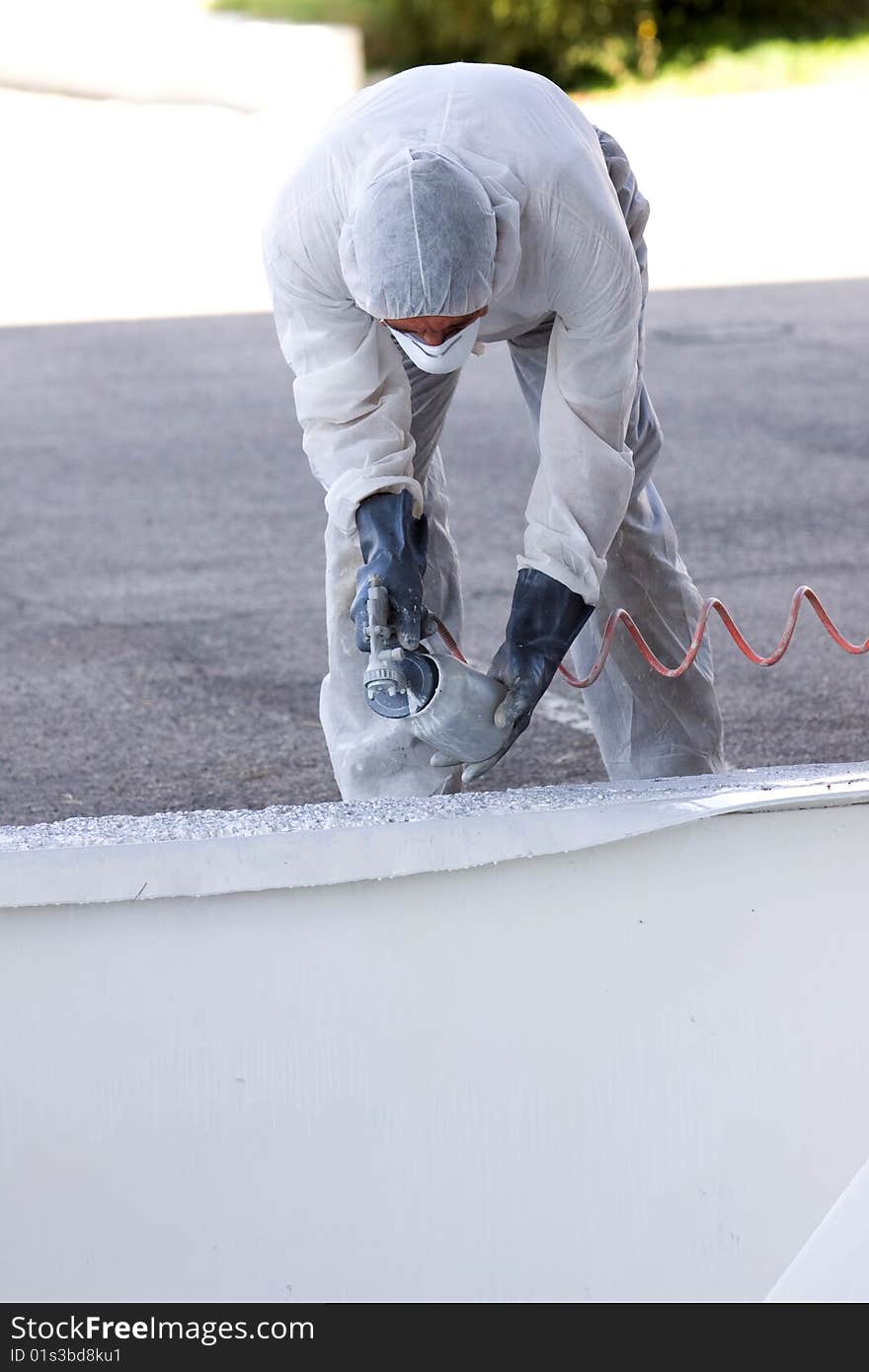 A painter at work in his construction site