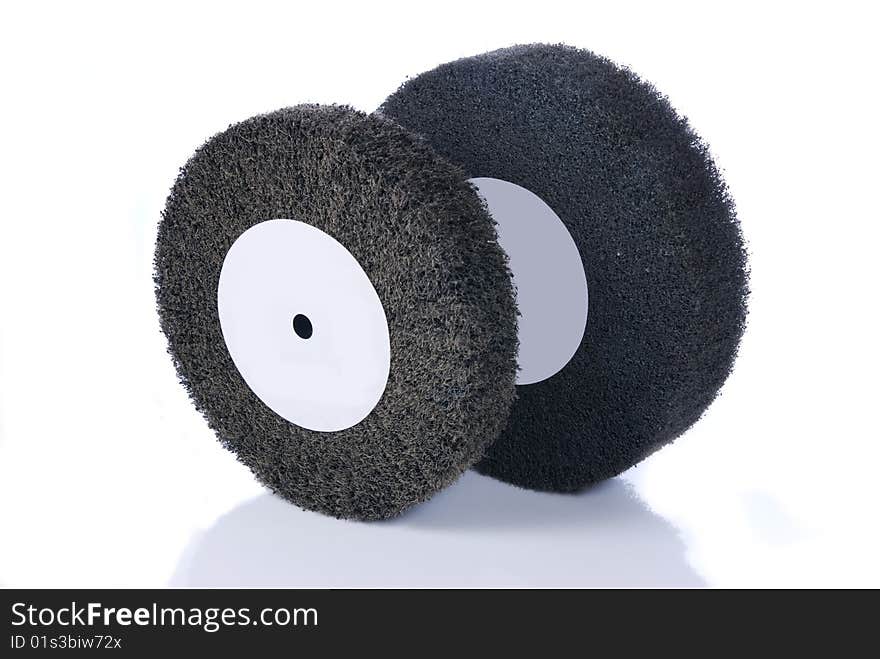 Black and gray, abrasive flap wheels with reflection, isolated on white.