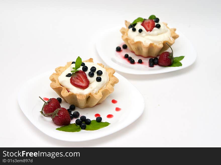 Delicious tarts with berries and cream