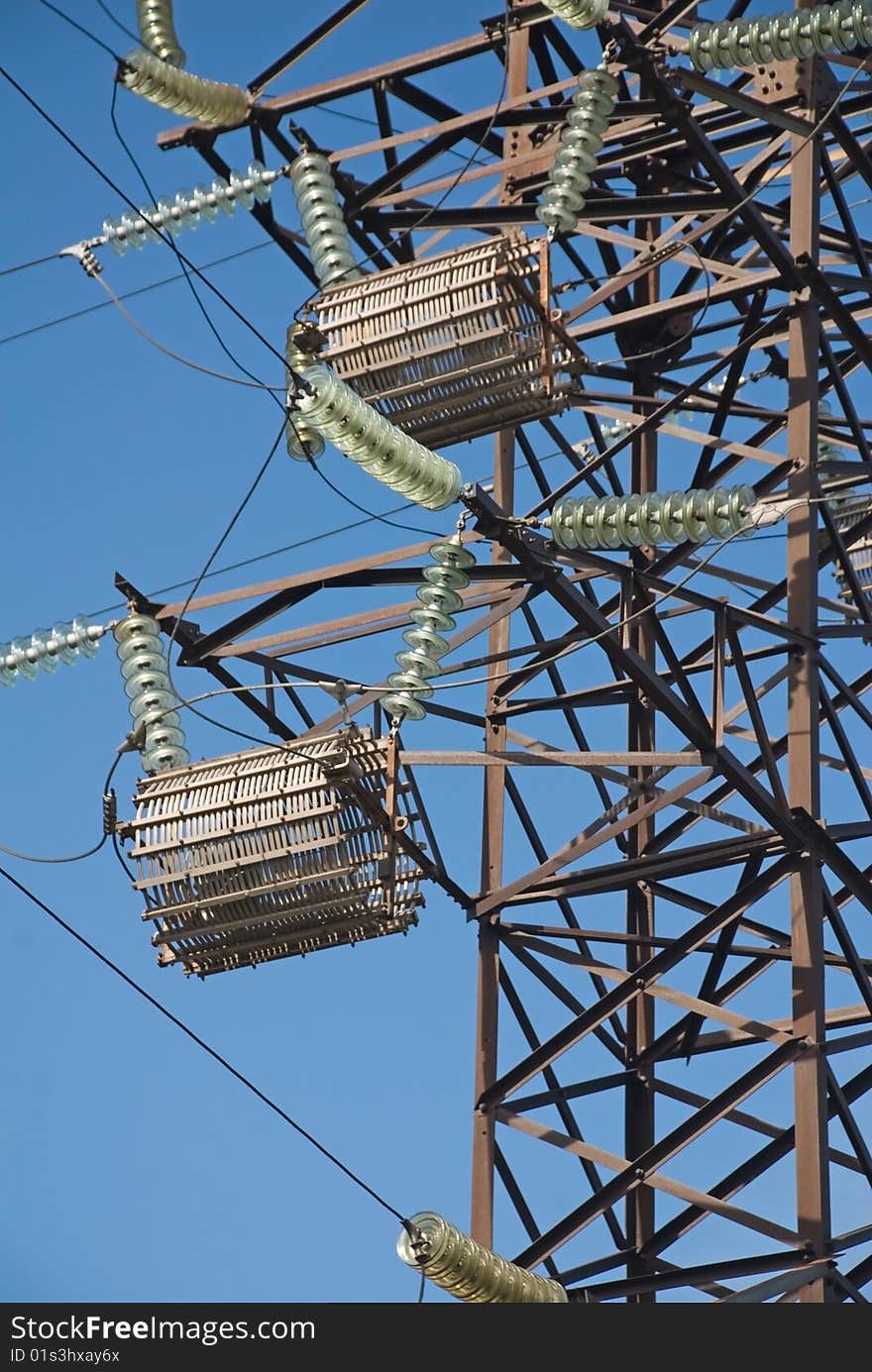 High-voltage post on a background blue sky