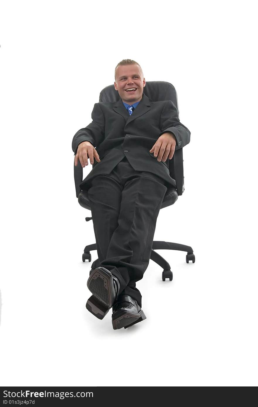 Arrogantly sitting but happily smiling businessman.On white background. Arrogantly sitting but happily smiling businessman.On white background.