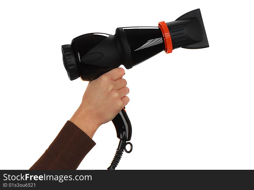 The girl holds the hand of a professional hair dryer in black with a nozzle on a light background. The girl holds the hand of a professional hair dryer in black with a nozzle on a light background