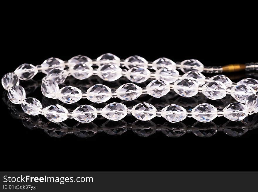 Crystal necklace on black in studio