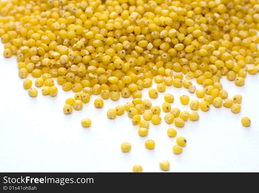 Yellow millet on white background