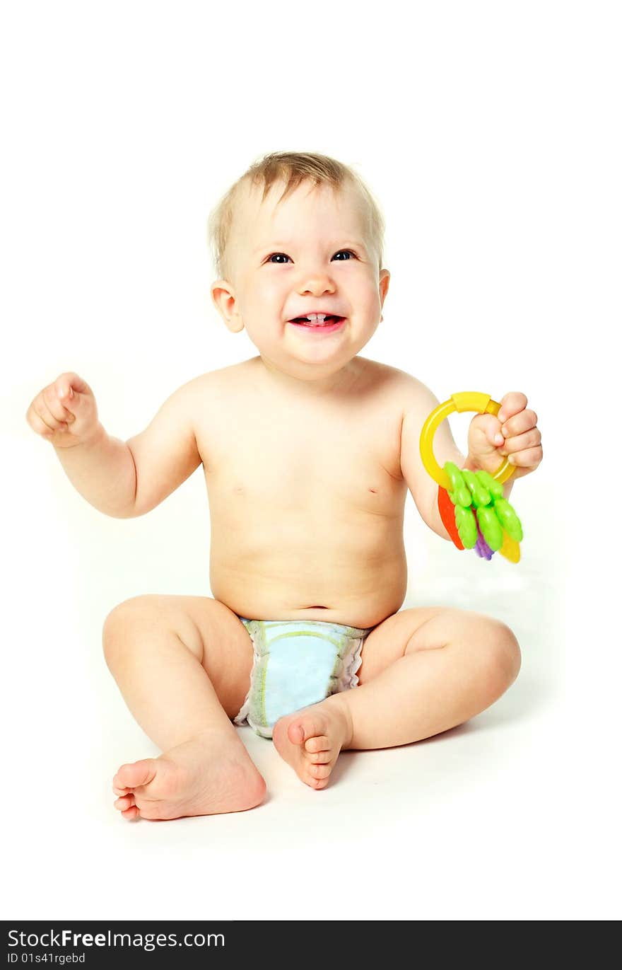 Happy little baby boy with a toy in his hands. Happy little baby boy with a toy in his hands