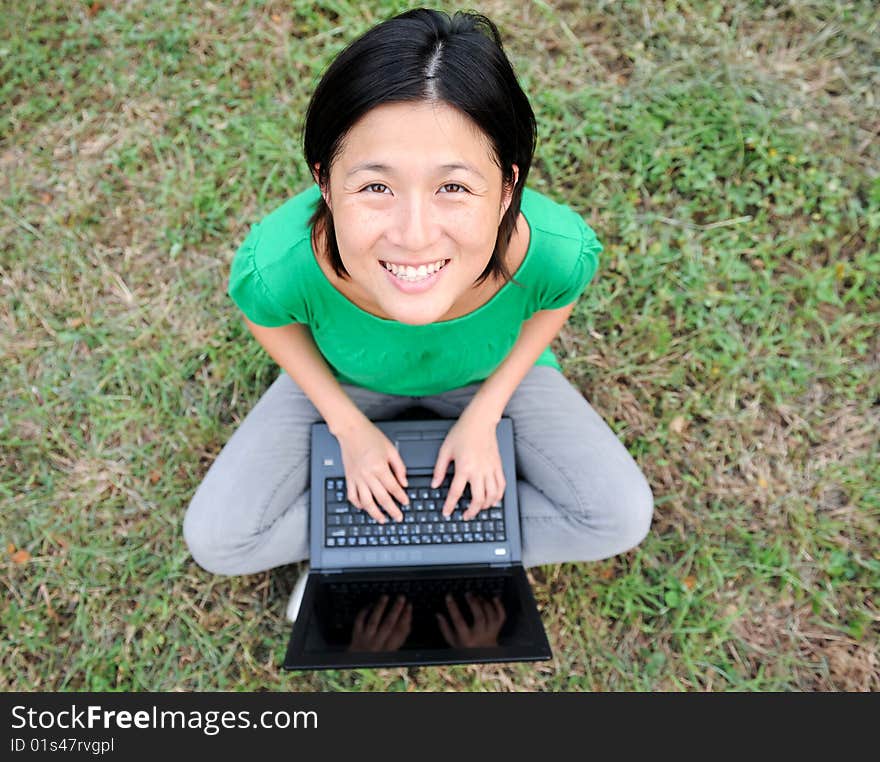 Asian Girl smiling with laptop