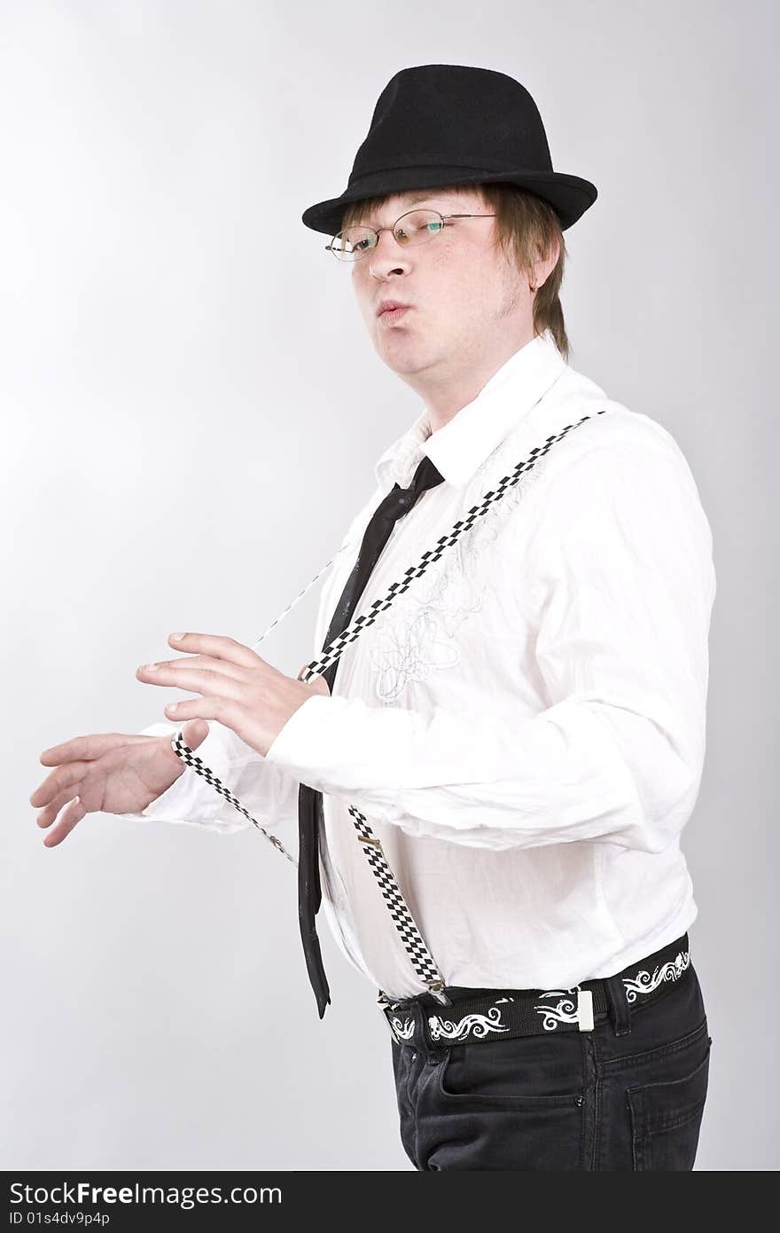 Man hat plays suspenders