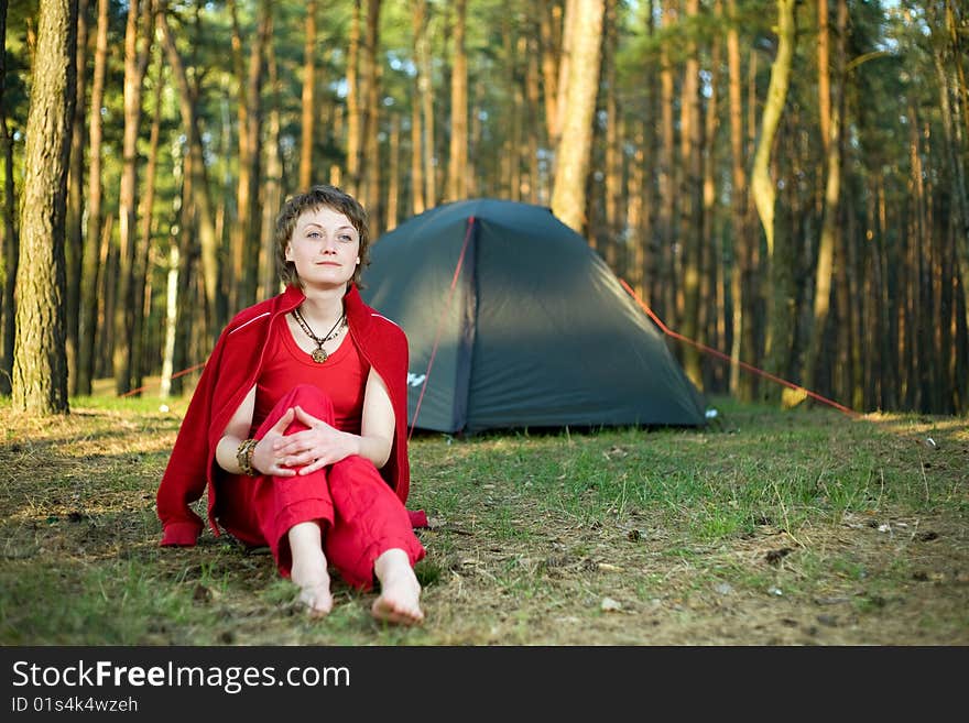 A pretty young woman relaxing in the forest. A pretty young woman relaxing in the forest