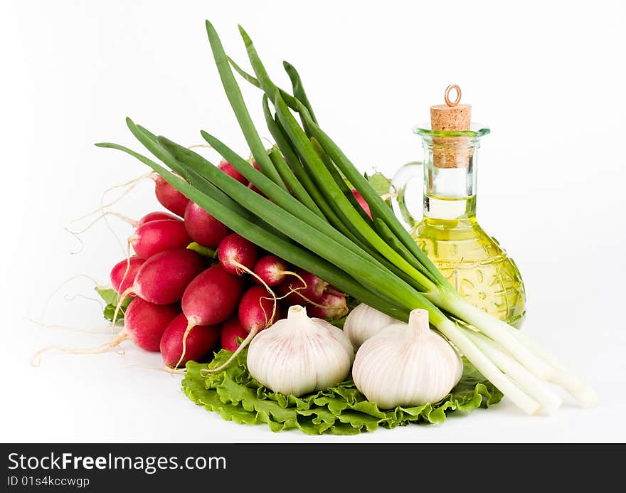 Green vegetables and  bottle of oil