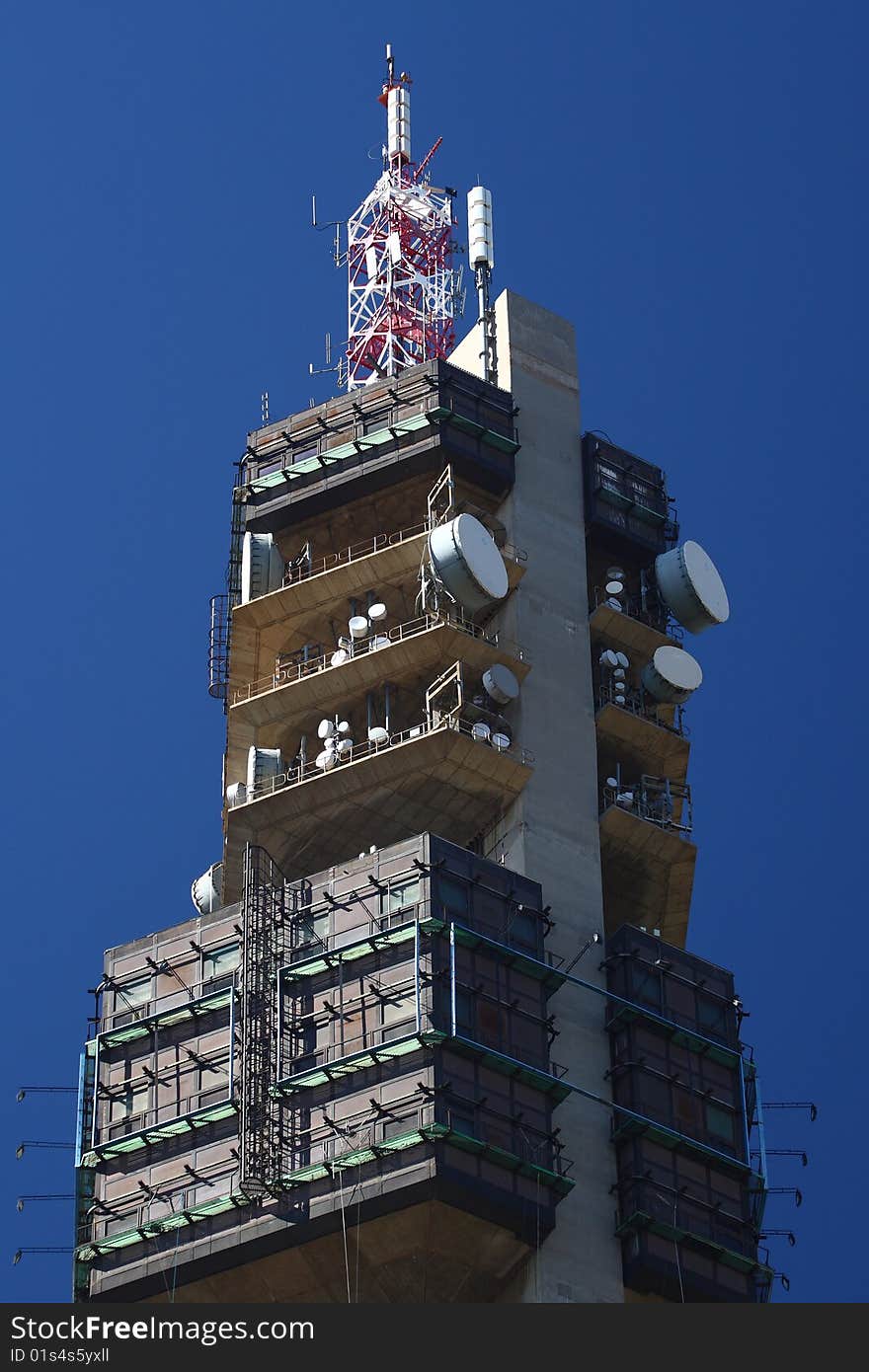 Large microwave tower build from concrete against a blue sky. Large microwave tower build from concrete against a blue sky