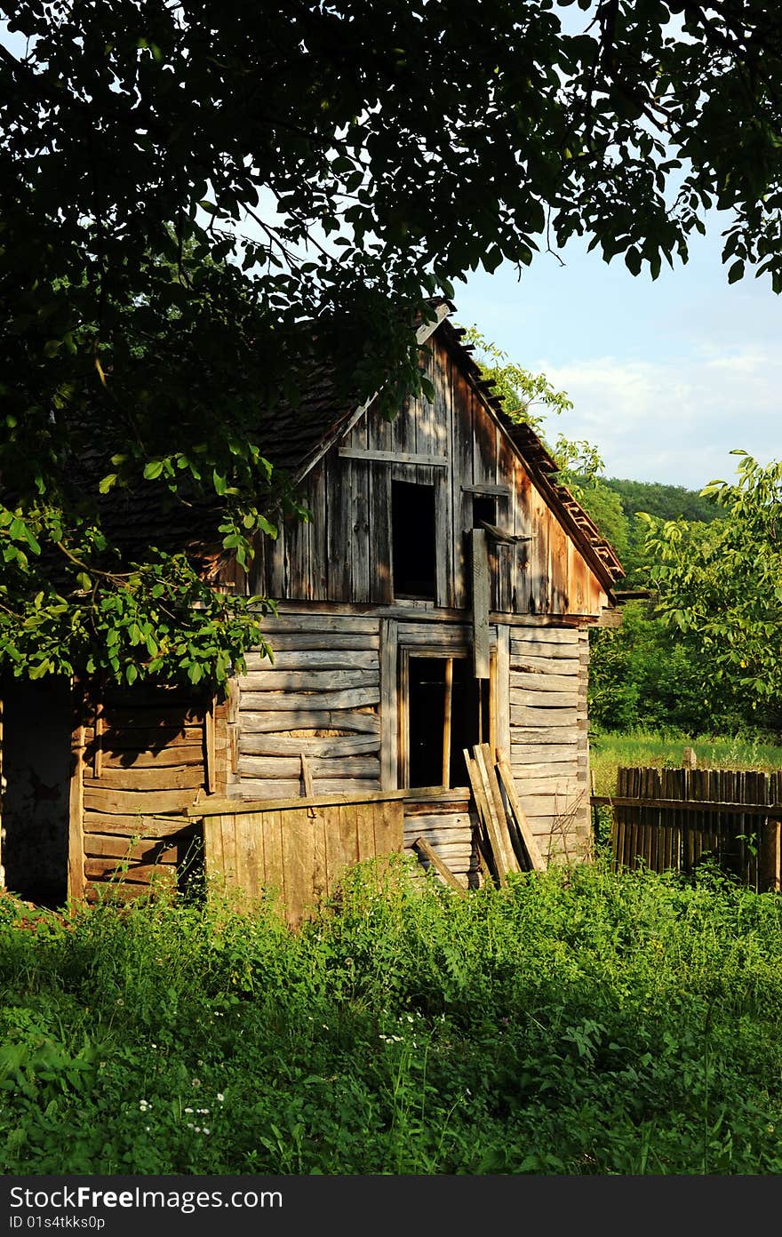 Old hut in country landscape